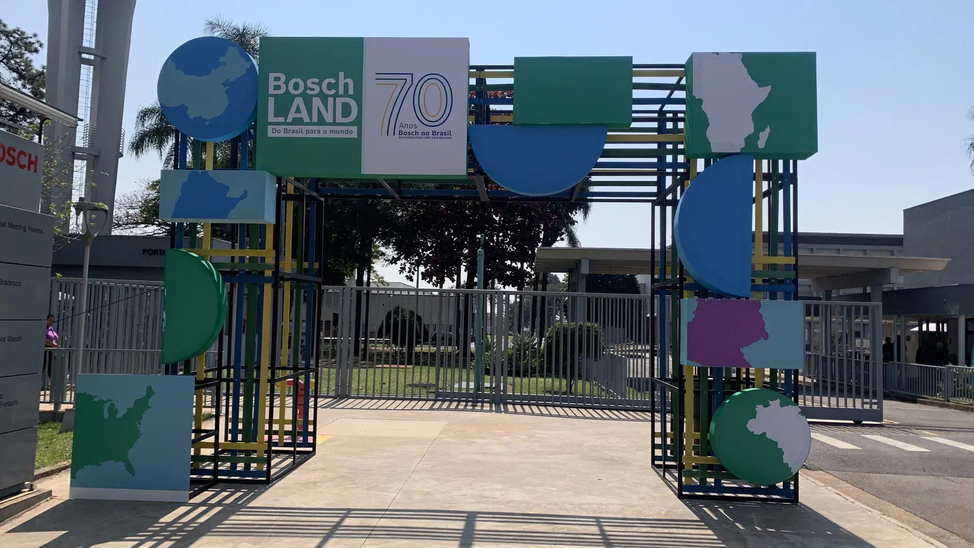 Boschland entrance gate, with the 70-year seal and panels cut in the shape of maps