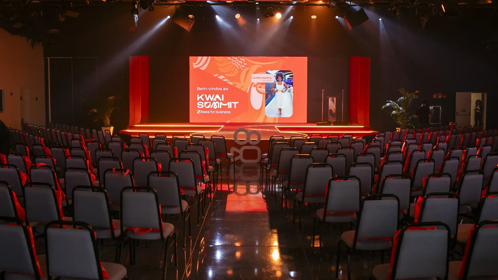 Auditorium set up before the opening, with empty chairs facing the screen