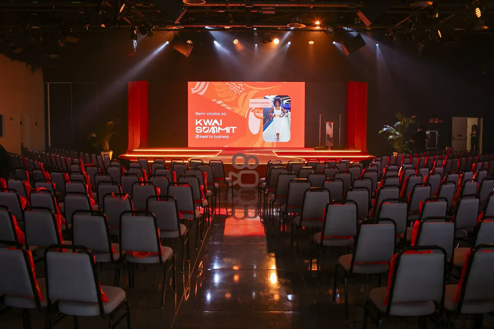 Auditorium set up before the opening, with empty chairs facing the screen